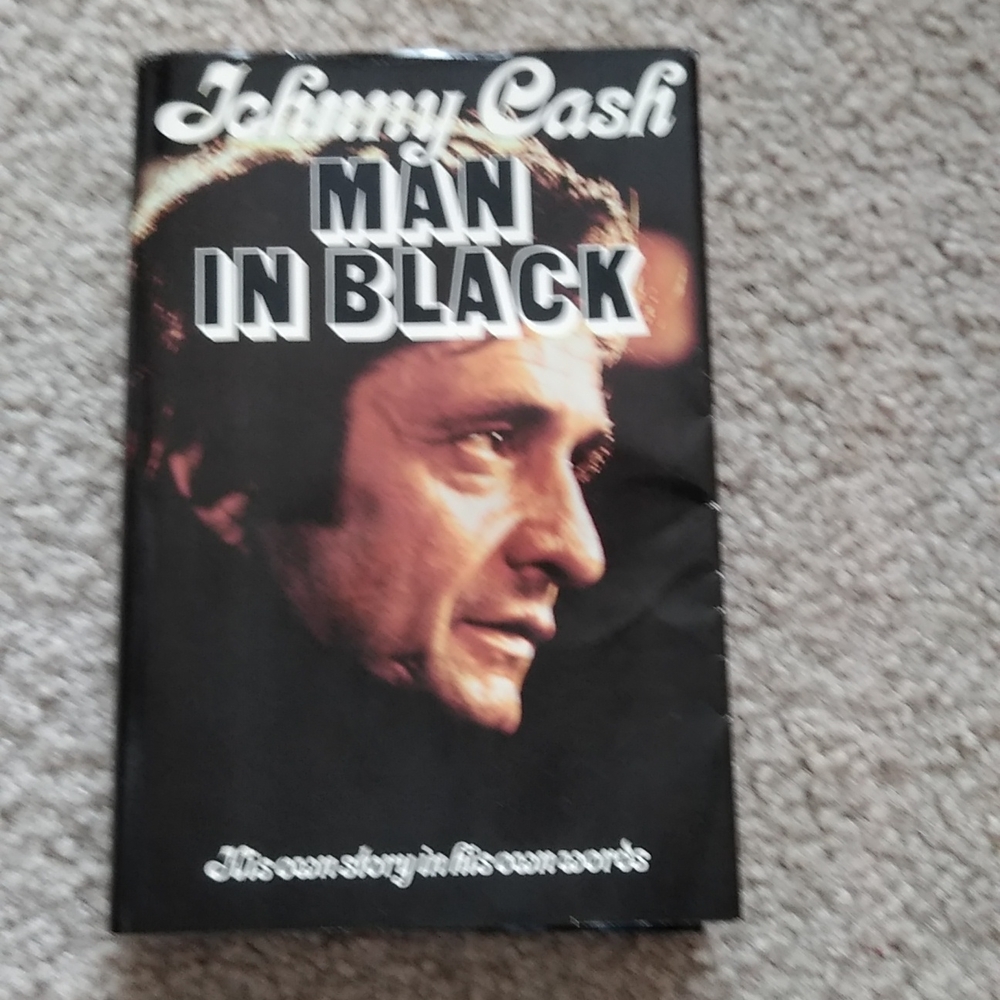 Vintage Johnny cash man in black autographed book
